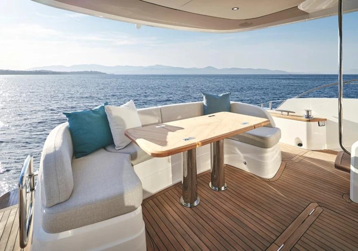 Luxurious 2025 Princess F65 yacht deck with elegant seating and ocean view.