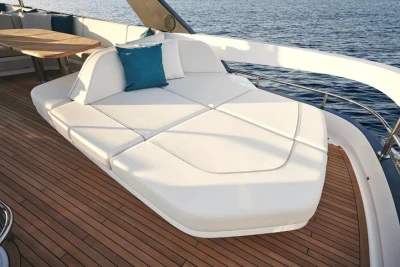 Luxurious 2025 Princess F65 yacht deck with elegant white seating and ocean view.