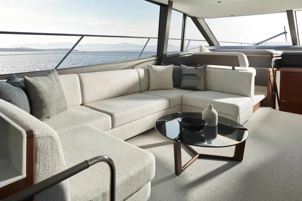 Luxurious interior of 2025 Princess F65 yacht with elegant seating and sea view.