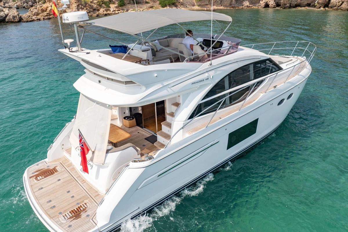 Luxury 2018 Princess 49 yacht cruising in clear blue waters.