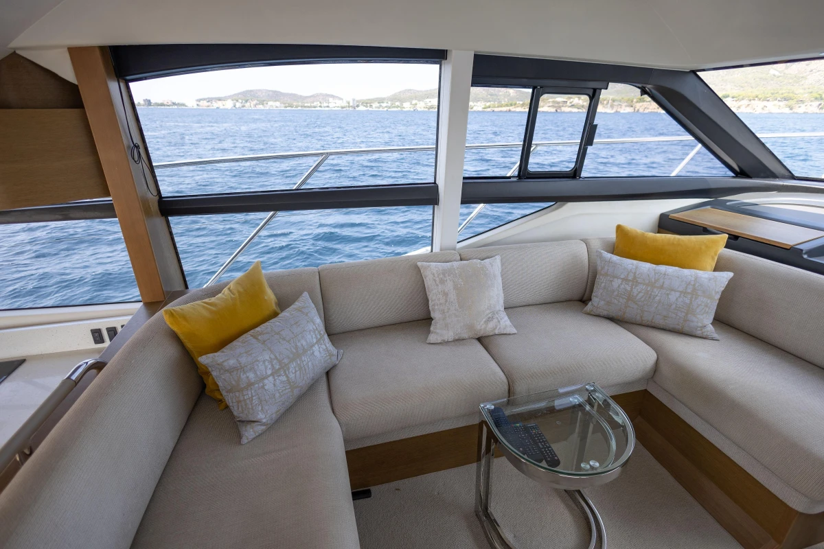Luxurious interior of 2018 Princess 49 yacht with elegant seating and ocean view.