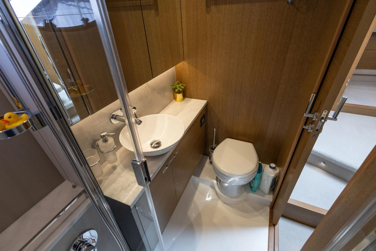 Luxurious bathroom in 2018 Princess 49 yacht with modern fixtures and wooden accents.