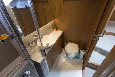 Luxurious bathroom in 2018 Princess 49 yacht with modern fixtures and wooden accents.