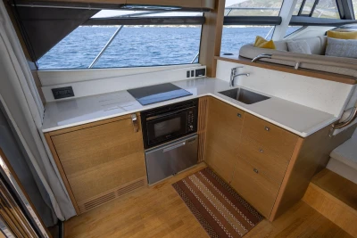 Modern kitchen interior on 2018 Princess 49 yacht with ocean view.