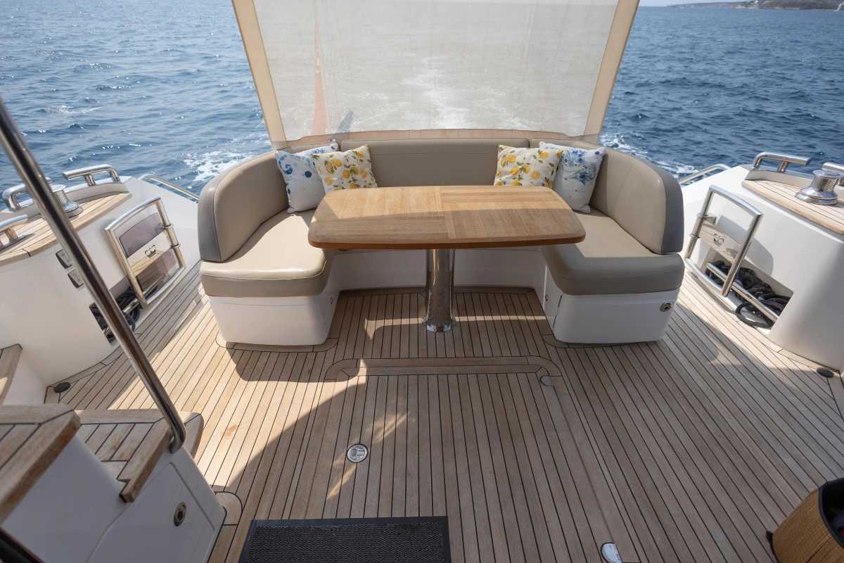 Luxurious 2018 Princess 49 yacht deck with elegant seating and ocean view.