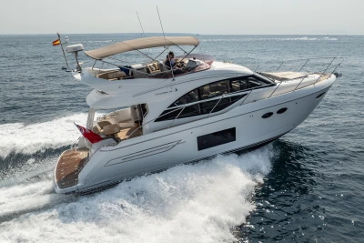 2018 Princess 49 yacht cruising on open sea, showcasing luxury design and performance.