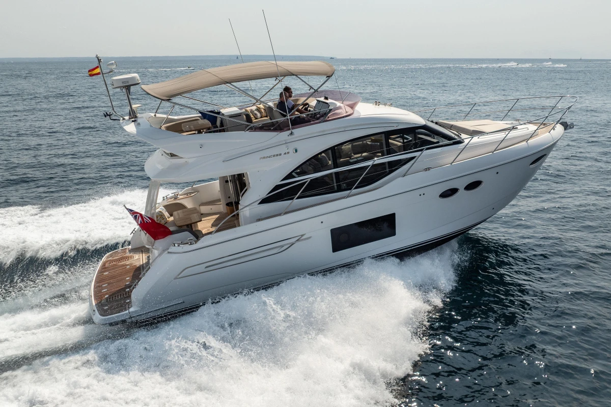 2018 Princess 49 yacht cruising on open sea, showcasing luxury design and performance.
