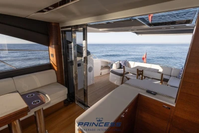 Luxurious 2019 Princess S60 yacht interior with ocean view and elegant seating area.