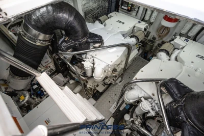 Engine room of a 2019 Princess S60 yacht, showcasing dual engines and mechanical components.