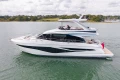 Luxury 2025 Princess F58 yacht cruising on calm waters, showcasing sleek design and elegance.