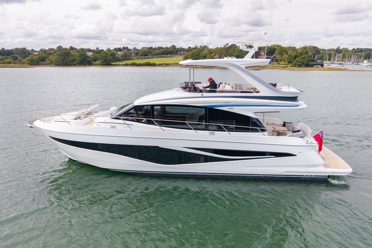 Luxury 2025 Princess F58 yacht cruising on calm waters, showcasing sleek design and elegance.