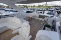 Luxurious 2025 Princess F58 yacht with spacious deck and elegant seating at marina.