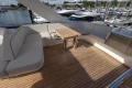 Luxurious 2025 Princess F58 yacht deck with elegant seating and wooden table.