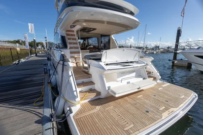 Luxury Princess F58 yacht docked, showcasing elegant design and spacious deck, 2025 model.