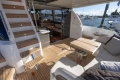 Luxurious 2025 Princess F58 yacht interior with elegant seating and wooden accents.