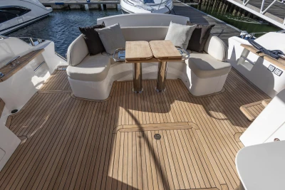 Luxurious 2025 Princess F58 yacht deck with elegant seating and wooden flooring.