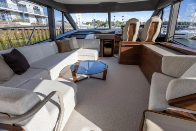 Luxurious interior of 2025 Princess F58 yacht with elegant seating and modern design.
