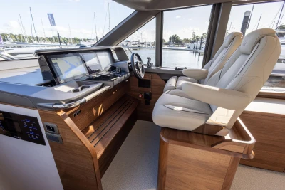 Luxurious 2025 Princess F58 yacht cockpit with modern navigation systems and plush seating.