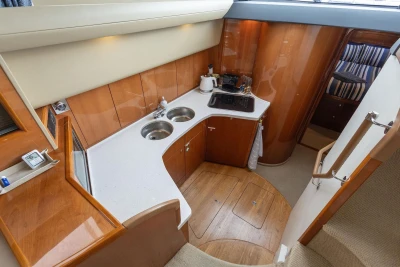 Luxurious kitchen interior of 2005 Princess 42 Flybridge Motor Yacht with modern amenities.