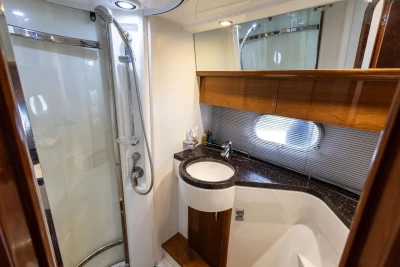 Luxurious bathroom in 2005 Princess 42 Flybridge Motor Yacht with shower and sleek design.