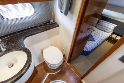 Luxurious bathroom and bedroom in 2005 Princess 42 Flybridge Motor Yacht.