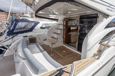 2005 Princess 42 Flybridge Motor Yacht with spacious deck and elegant interior.