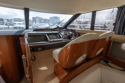 Luxurious helm of 2005 Princess 42 Flybridge Motor Yacht with modern navigation equipment.
