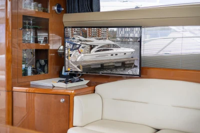 Luxurious interior of 2005 Princess 42 Flybridge Motor Yacht with TV and elegant decor.
