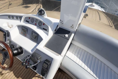 Flybridge helm of 2005 Princess 42 Motor Yacht with navigation instruments and controls.