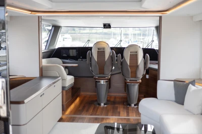 Luxurious interior of 2023 Princess X80 yacht with modern seating and elegant design.