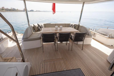 Luxurious 2024 Princess X80 yacht deck with elegant seating and ocean view.