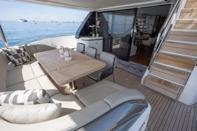 Luxurious 2024 Princess X80 yacht deck with elegant seating and ocean view.