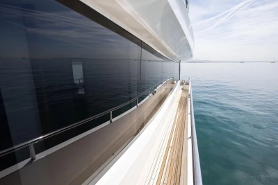 Sleek 2024 Princess X80 yacht cruising on calm ocean waters.