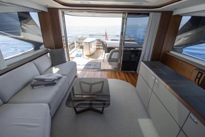Luxurious interior of 2024 Princess X80 yacht with ocean view and modern furnishings.