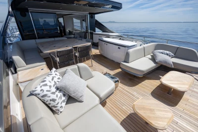 Luxurious 2024 Princess X80 yacht deck with elegant seating and ocean view.