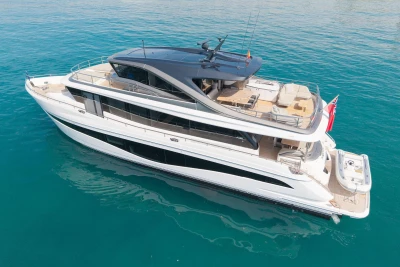 Luxurious 2024 Princess X80 yacht cruising on clear blue waters.