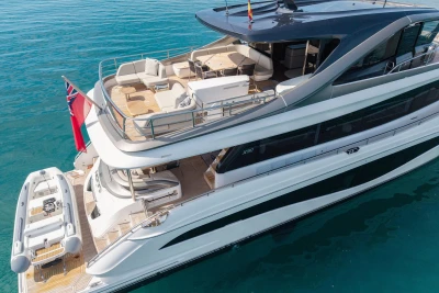 Luxurious 2024 Princess X80 yacht with spacious deck and elegant design on clear blue water.