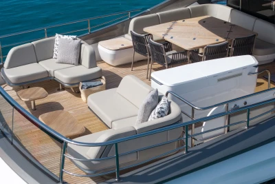 Luxurious 2024 Princess X80 yacht deck with elegant seating and dining area.