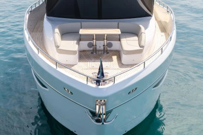 Luxurious 2024 Princess X80 yacht with elegant seating and table on the deck.