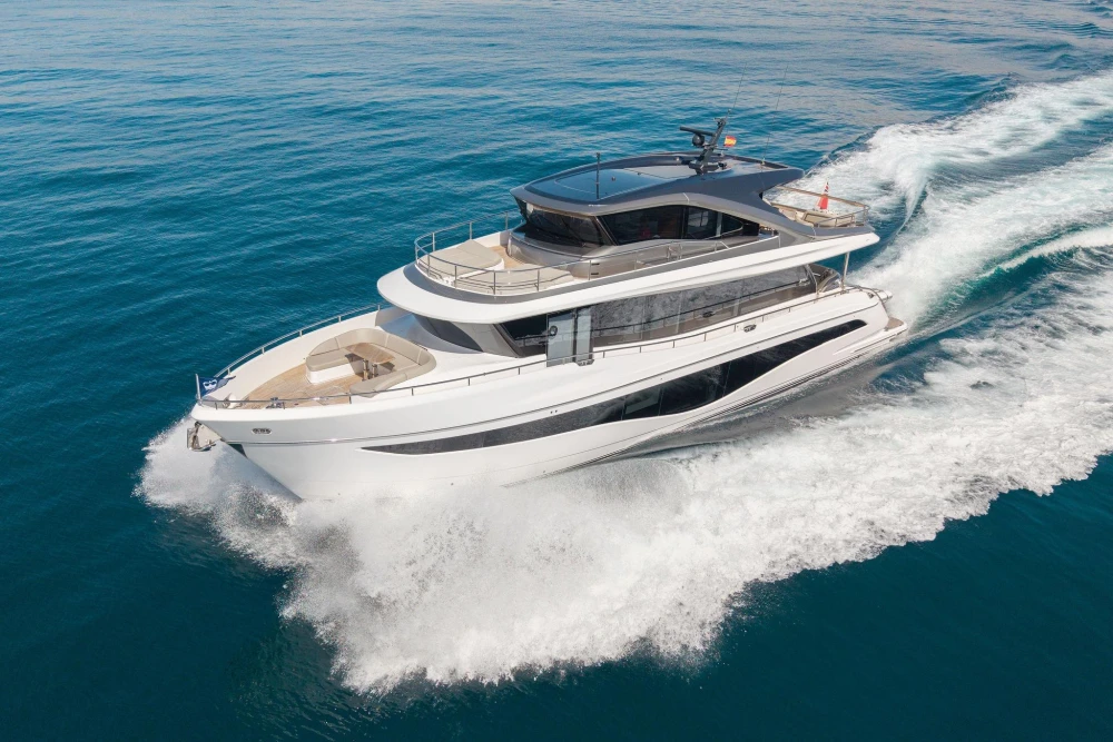 Luxurious 2024 Princess X80 yacht cruising on open sea, showcasing sleek design and elegance.