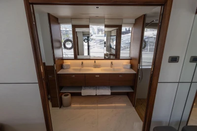 Luxurious bathroom interior of 2024 Princess X80 yacht with dual sinks and modern design.