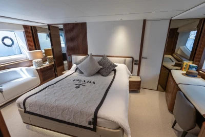 Luxurious bedroom interior of 2024 Princess X80 yacht with elegant decor and natural light.