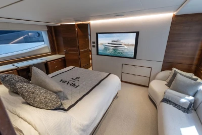 Luxurious 2024 Princess X80 yacht bedroom with elegant decor and modern amenities.