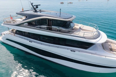 2024 Princess X80 luxury yacht on serene blue waters, showcasing sleek design and spacious decks.