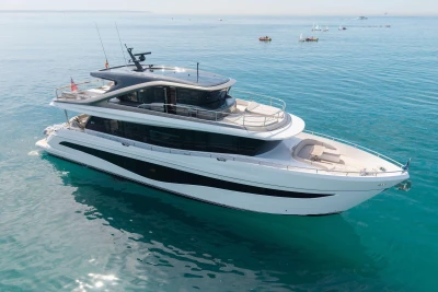 Luxurious 2024 Princess X80 yacht cruising on serene blue waters.