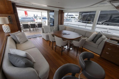 Luxurious interior of 2024 Princess X80 yacht with elegant seating and dining area.