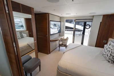Luxurious interior of 2024 Princess X80 yacht with elegant bedroom and modern decor.