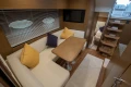 Luxurious interior of 2017 Princess V48 Open yacht with cozy seating and modern decor.