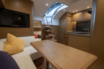 Luxurious interior of 2017 Princess V48 Open yacht with modern kitchen and seating area.