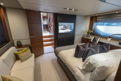 Luxurious 2018 Princess S65 yacht bedroom with elegant decor and modern furnishings.